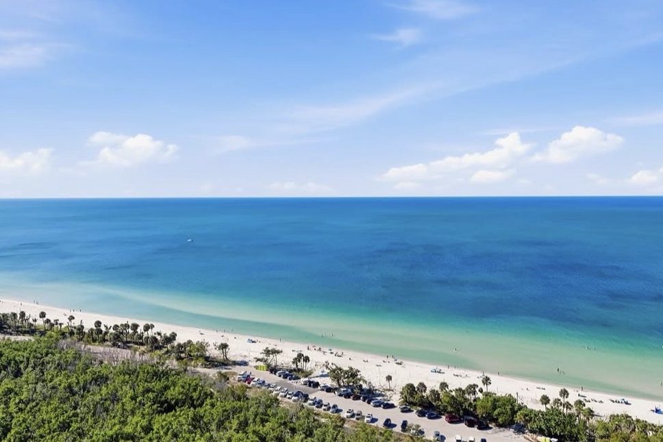 A white-sand beach with palms in Gulf Breeze