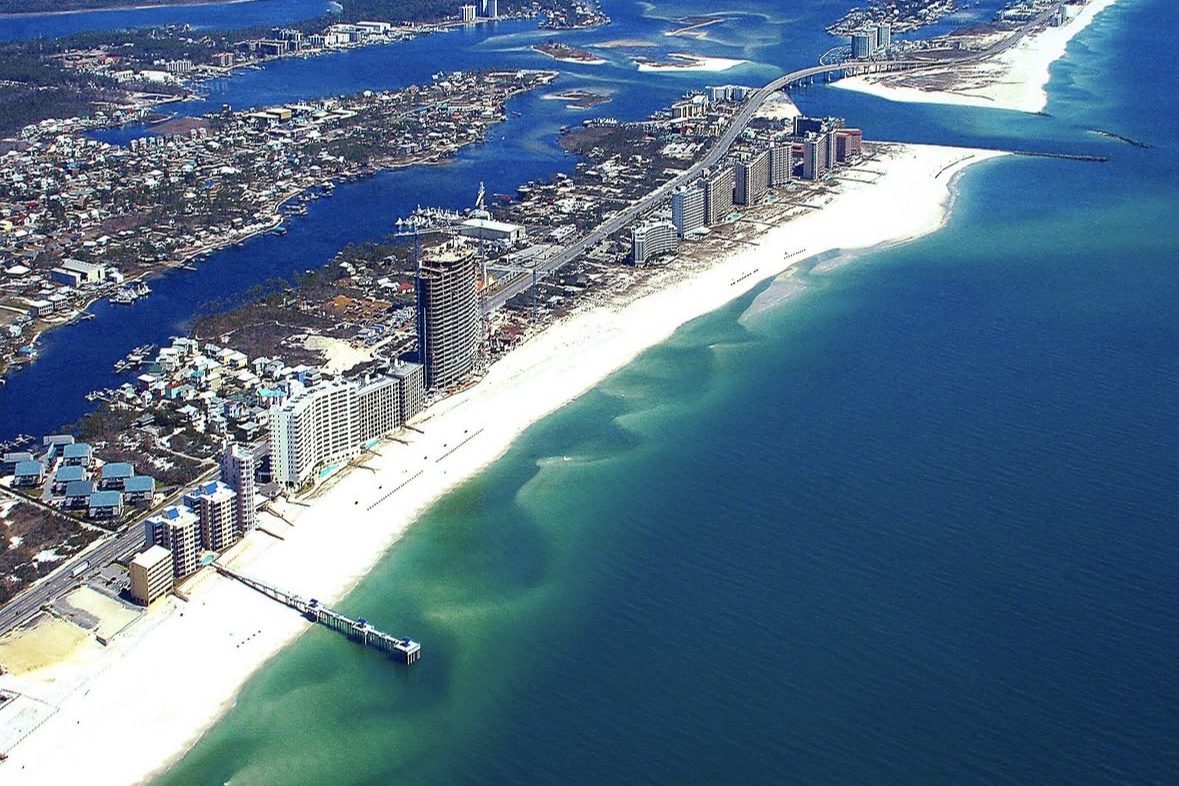 Aerial view of the Gulf Shores beachfront, pier and back bays